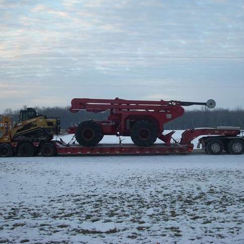 Semi with lowboy to haul equipment